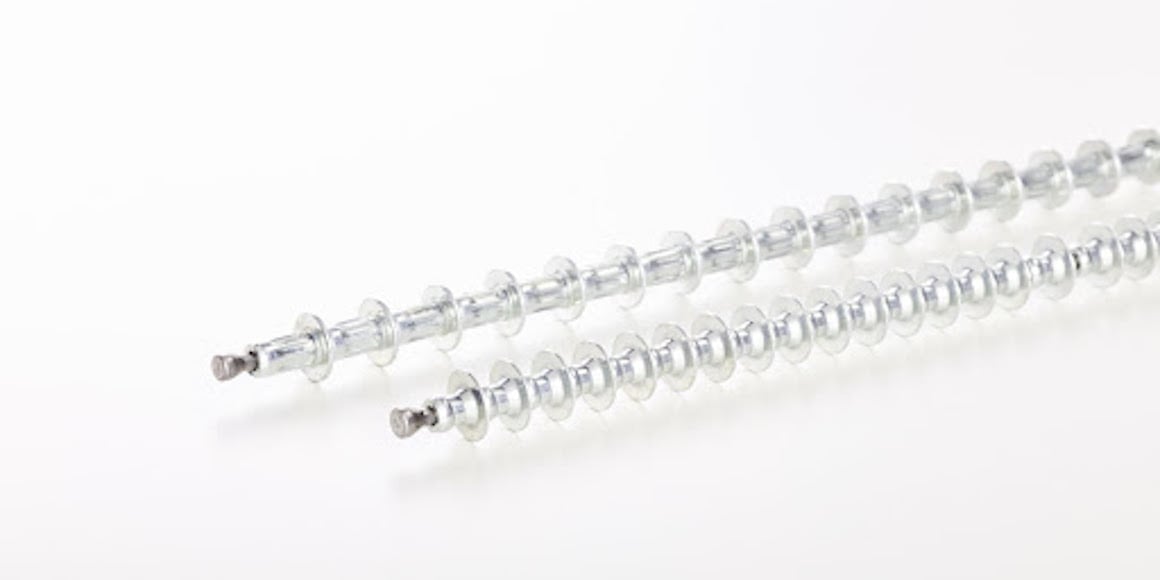 Silver fastening system parts on a white background