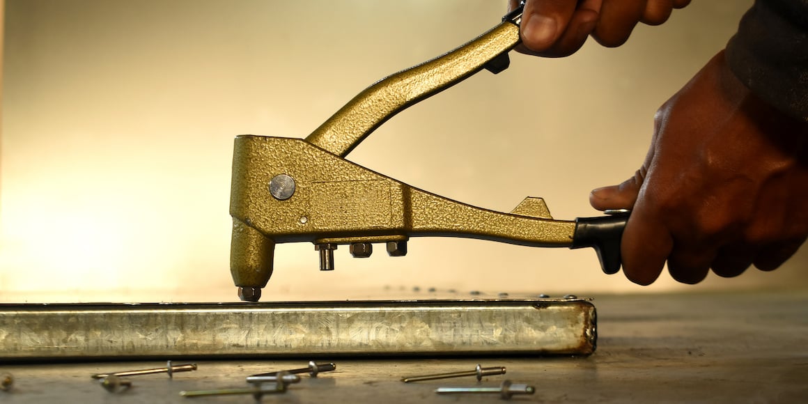 Man Setting a Pop Rivet