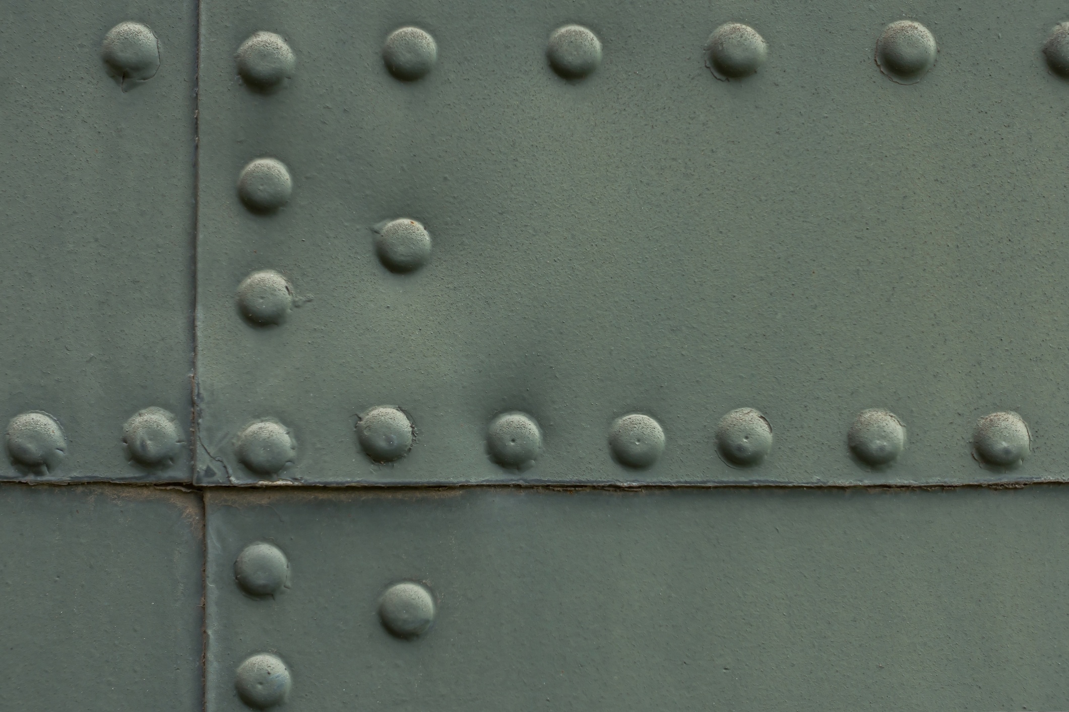 rivets popping as silo falls