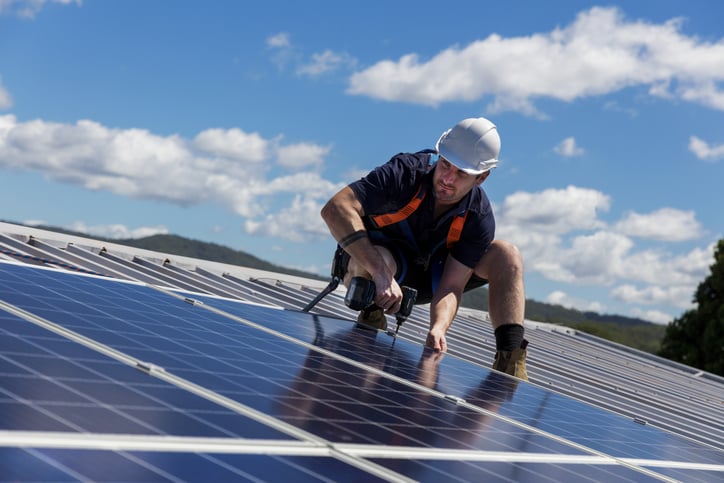 Man Installing Solar Panels with Blind Bolts